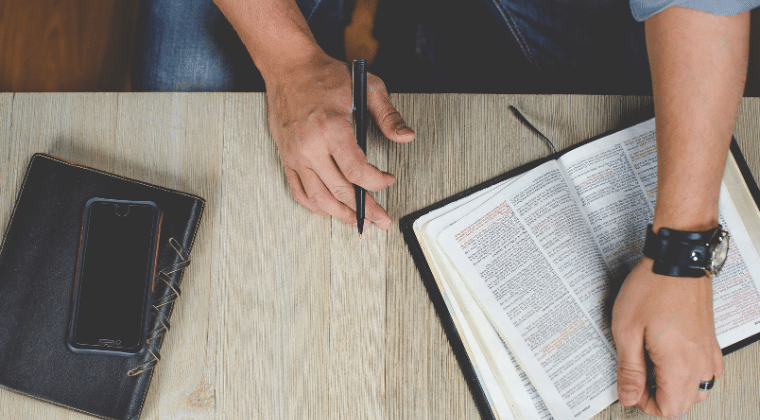 Man Reading a Bible Top View Diploma in Christian Ministry Church Answers