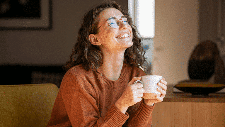 Happy Woman Enjoying Coffee at Home. Love & Unashamed. Church Equip Romans 